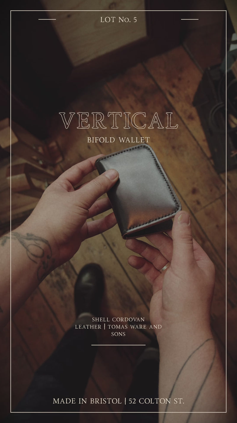 The Cash & Card Case Wallet is outfitted with four card compartments and two large compartments for folded cash or additional cards. Black and Ruby. Made By Lone Rambler Dry Goods Store